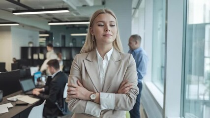 Poster - A confident professional woman stands in an office, observing her surroundings.