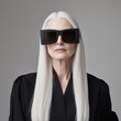 © Hamza - Dramatic portrait older woman with long, sleek white hair, wearing oversized black sunglasses and a sophisticated black outfit