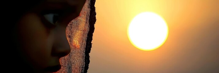 Poster -  A tight shot of a face gazing at the sun behind a foreground curtain