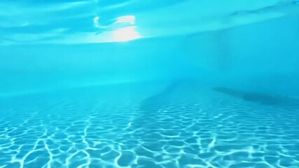 Wall Mural - pure blue water in the pool with light reflections. blue water in the pool. waves in the pool. pure 