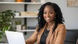 © Berkah - Pretty african american business woman working on laptop in office.