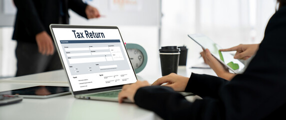 Online tax return form for submitting individual income tax return form snugly on the internet website. Government web for tax payment and return. Taxation technology concept.