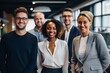 © Baba Images - Smiling portrait of a diverse group of business people in office