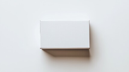 Fototapete - White box mockup for a banner featuring a small cardboard box with a closed lid set against a light backdrop viewed from above