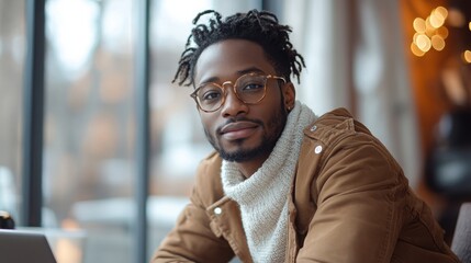 Poster - Young Black freelancer creates website designs in a cozy workspace during the afternoon
