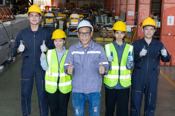 Group of engineers boost customer confidence. Teamwork concept. Group of young businessmen working as a team and shaking hands.