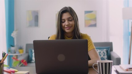 Young Hispanic Marketing Specialist Working on Laptop Computer in Home Office Beautiful Multiethnic Female Project Manager is Working Remotely.