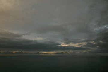 Wall Mural - raining sunset sky over the atlantic ocean, tenerife. minimalism. misty dusk in the sea. dramatic vi