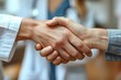 © Oleksandr - Doctors handshake in hospital, symbolizing cooperation and trust