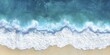 © Happiness Maker - Aerial View of Ocean Waves Crashing on Sandy Beach