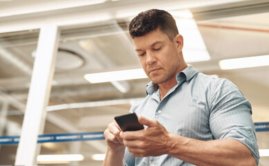 Poster - Businessman, typing and phone with app for social media, communication or reading news at office. Young, man or employee with mobile smartphone for online chatting, texting or connection at workplace