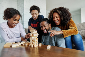 child family fun toy game mother playing block girl wooden education father learning toy block home daughter boy woman tower together creativity bonding