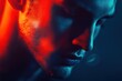© Mroyek - Close-up Portrait of a Man in Red and Blue Lighting