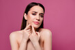 © Beauty Hero - Photo of unhappy girl look touch chin squeeze acne pimple on pink color background
