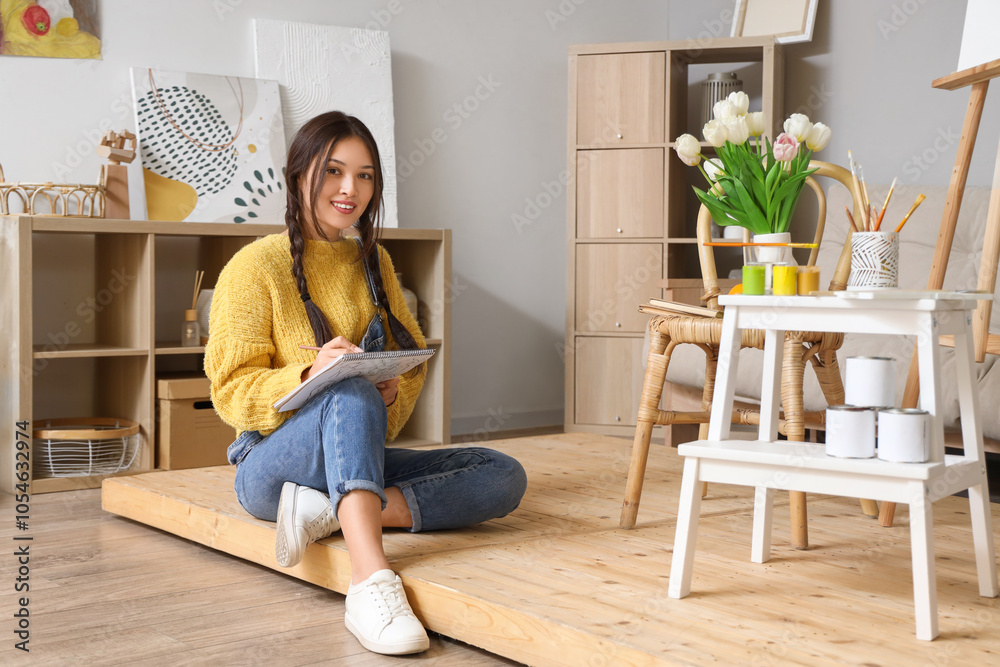 Female Asian artist drawing sketch at home