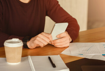 Poster - Business App. Unrecognizable Guy Using Smartphone Sitting At Workplace In Modern Office. Cropped, Selective Focus