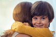 © peopleimages.com - Hug, smile and adoption with family at home for foster care, bonding and support. Child welfare, placement success and security with mother and son embrace in living room for happiness together