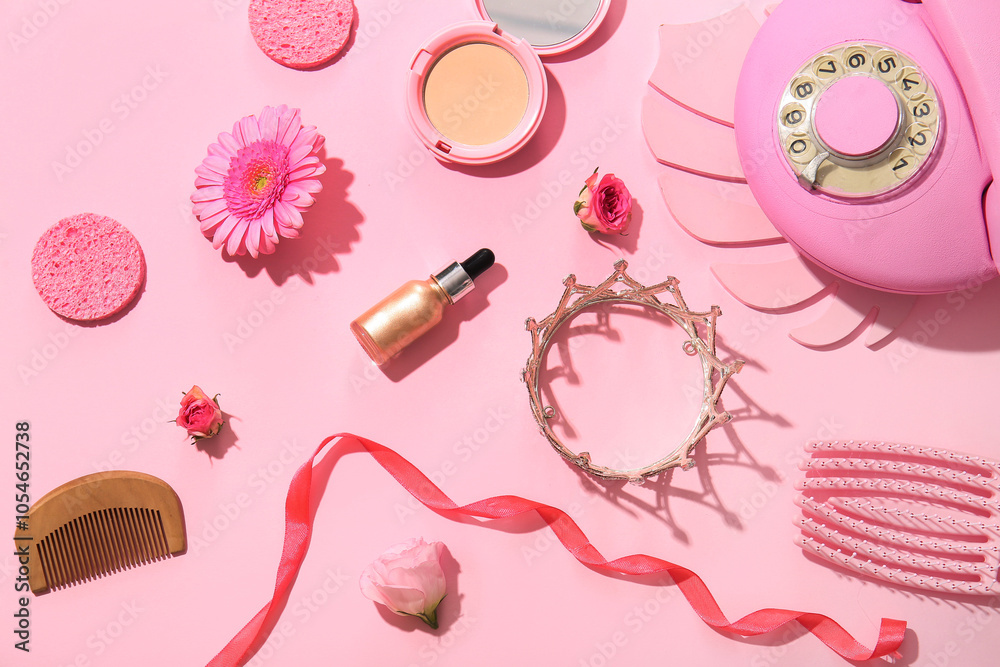 Composition with decorative cosmetics, accessories and vintage telephone on pink background