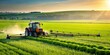 © udomsak - Farming tractor crop sprayer working in a lush green field, Agriculture, tractor, farm, crop, sprayer, rural