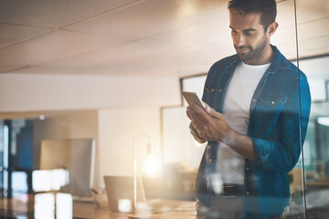 Poster - Man, phone and texting at startup, night and overtime with update, reading and contact with app at company. Person, smartphone and check notification with smile, office or web chat at creative agency