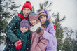 © deagreez - Photo of cheerful full family cuddle enjoy each other walking free time woods snowfall outside