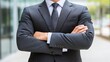 © Generative AI - Confident Businessman in a Formal Suit With Arms Crossed Standing Outdoors : Generative AI