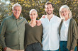 © peopleimages.com - Senior parents, couple and portrait in garden with hug, smile and outdoor with family, care and love. Men, women and embrace with pride, happy and connection in backyard with sunshine in Germany