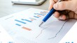 © diracreativa - Business Analyst Analyzing Data Charts with Pen