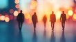© Jakrapan - Silhouettes of business professionals walking towards a bright future in an urban setting with a beautiful bokeh background