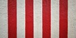 © Latsamee - White and red striped stucco wall background texture with silhouette of objects
