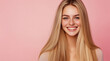 © muhammadarslan - Radiant blonde woman with glossy, honey-blonde hair and a warm smile, standing against a light pink background to showcase her straight, flowing hairstyle