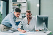 © ARMMY PICCA - Two businessmen working together Analyze financial reports with charts and graphs while using the calculator to calculate budget, income, taxes, business growth. Startup business idea.