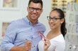 © auremar - couple in optician glasses store