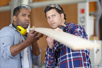 two wood designer working in a workshop