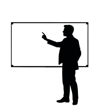 A businessman silhouette pointing towards a whiteboard