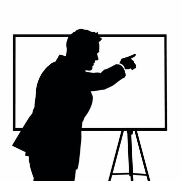 A businessman silhouette pointing towards a whiteboard