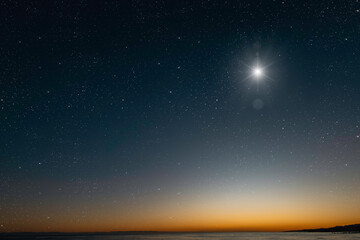 Wall Mural - christmas star shines at night over the mountains of bethlehem