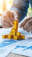 Poster - hands carefully placing a gold bar on a financial chart showing inflation rates, representing wealth