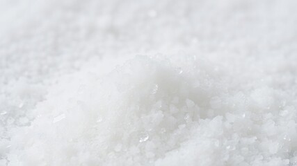 A close-up shot of pure white granulated sugar on a pristine white background, clean, granulated