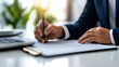 © Edgar Martirosyan - person signing a document