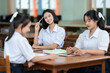 © Nutchapong Wuttisak - The Asian high school girl with long hair is reminded that each book in the library represents a journey toward greater education and a wealth of knowledge waiting to be explored.