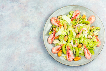 Wall Mural - Seafood salad with shrimps and mussels on plate.