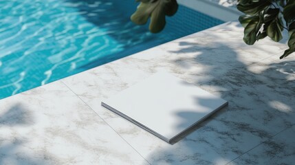 Blank magazine mockup design on a marble table beside a swimming pool