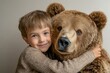 © SerPak - A cute five year old Russian boy shares a heartwarming hug with a friendly brown bear. Both display joyful expressions, creating a delightful scene filled with warmth and connection under natural ligh
