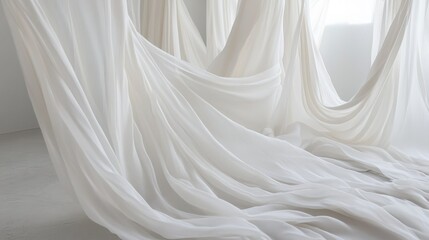 Aufkleber - Collection of gracefully flowing white fabrics on display