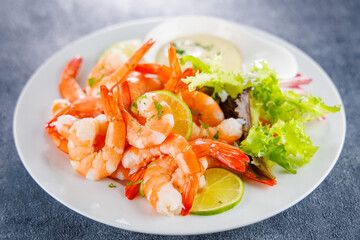 Wall Mural - plate of fresh shrimps with lemon and dipping sauce