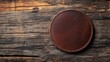 © AImmersive Imagery - Round leather coaster placed on a weathered wooden surface
