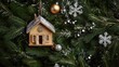 © 성환 이 - On vibrant green spruce branches, a wooden house ornament pairs with tiny sleigh bells and shimmering silver snowflakes