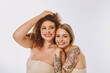 © Bliss - A lovely lesbian couple with natural makeup joyfully showcases their beauty and cultural diversity together.