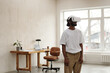© Clique Images - Young male architect wearing VR headset, engaged in virtual activity